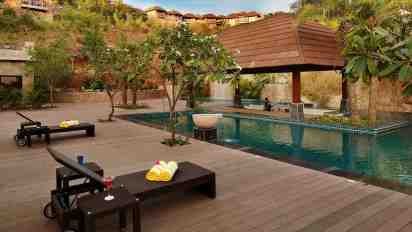 Swimming Pool with Outdoor Wood Planks in Ananta Resort