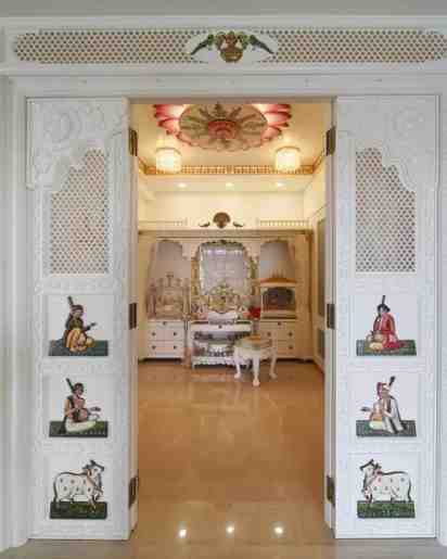 Pooja Room With Jali Work Door In Madhav Mahal Apartment