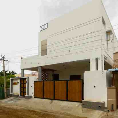 House Exterior of White Grooves Residence
