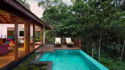 Swimming Pool with Wooden Deck and Sun Loungers in Pepper Trail Resort