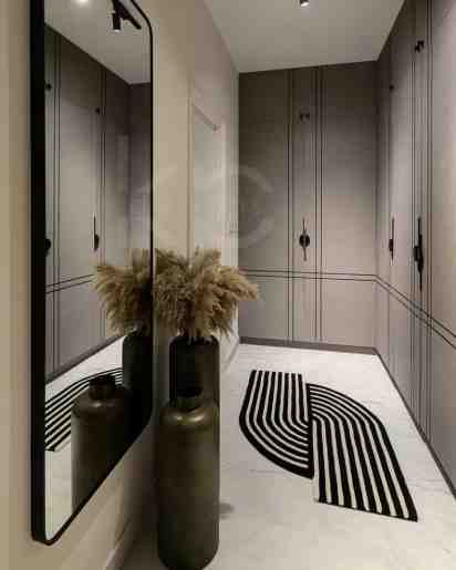 Walk in closet in Eclectic Ensemble residence