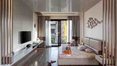 Bedroom with Wooden Flooring in Chattarpur Farmhouse