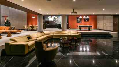 Living Room with L Shaped Sofa in Infinity House