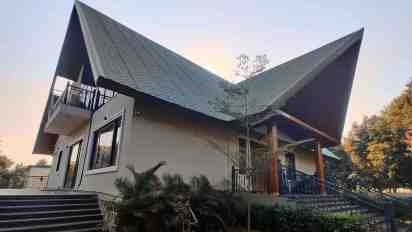 House Exterior with Sloping Roof of Farm House