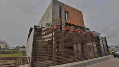 House Exterior with Wooden Cladding of Linear House